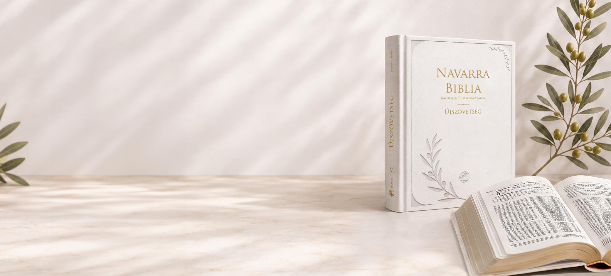 A Navarra Biblia fehér kötete egy nyitott Biblia és olajágak mellett